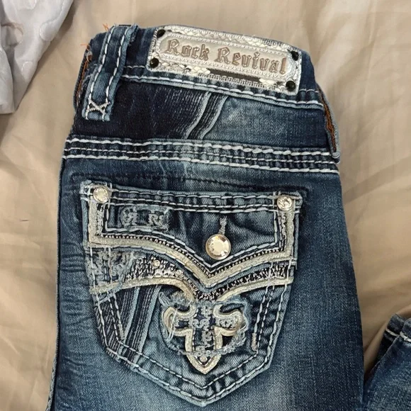 Rock Revival Blue Boot Cut Jeans with Embellished Pockets